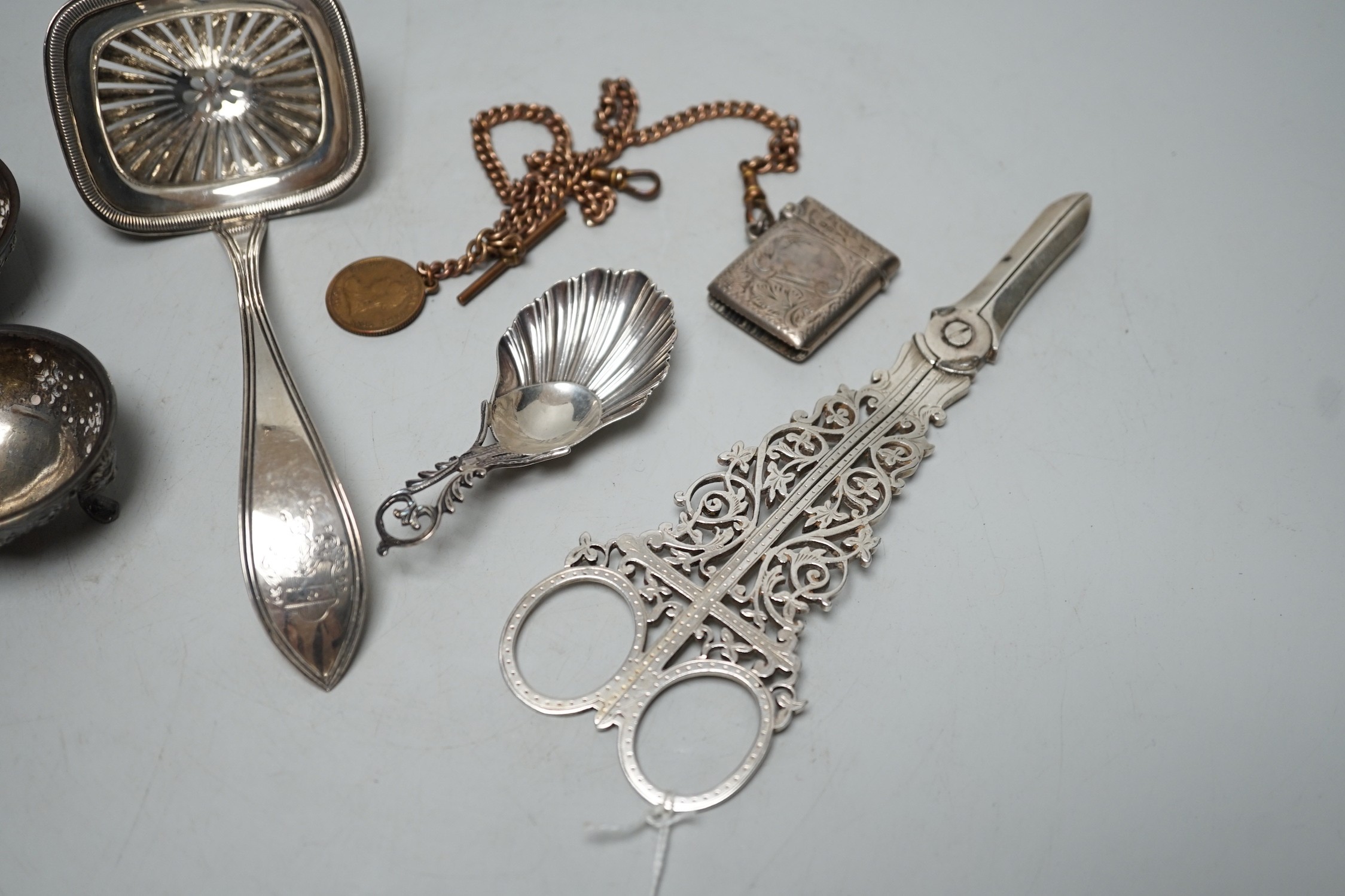 Sundry small silver including a pair of late Victorian grape shears, pair of Victorian salts caddy spoon and vesta case, together with a gilt metal albert chain and a Dutch white metal spoon.